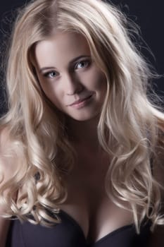 Smiling beautiful blonde with curly hair, close-up