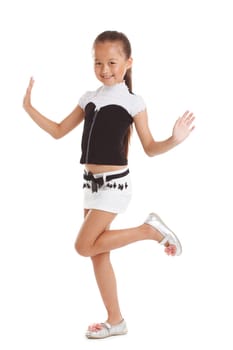 Cheerful little girl posing in fashionable clothes, isolated on white