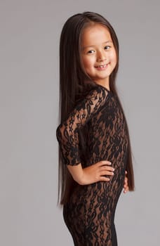 Portrait of elegant young brunette in lace dress, close-up