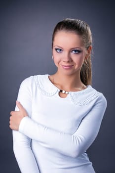Portrait of smiling expressive model posing in studio