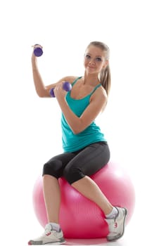 Attractive model posing with sports equipment, isolated on white