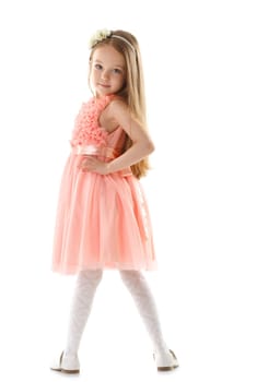 Adorable little girl posing looking at camera, isolated on white