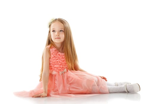 Pretty little girl posing in smart pink dress, isolated on white