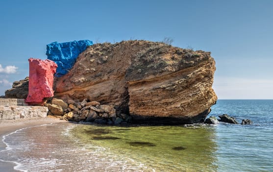 Shell rock boulders on the seashore on the Wild Beach in Odessa, Ukraine, on a sunny spring day