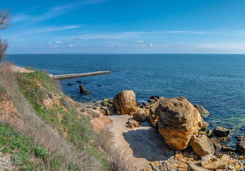 Coast of the Black Sea at the Wild Beach in Odessa, Ukraine, on a sunny spring day