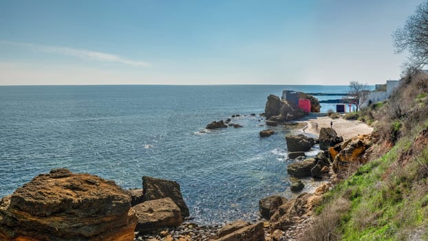 Shell rock boulders on the seashore on the Wild Beach in Odessa, Ukraine, on a sunny spring day