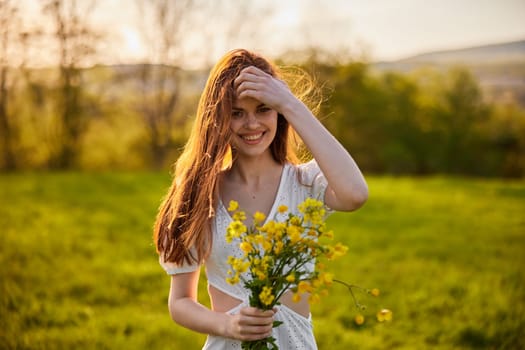 the woman is depicted in the countryside with a bouquet of yellow flowers. High quality photo