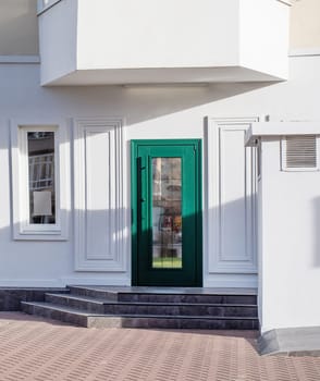 establishment exterior with white walls and green door, mockup design, shadow overlay