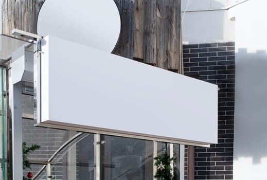 real establishment exterior with white walls , white rectangle logo for mockup design