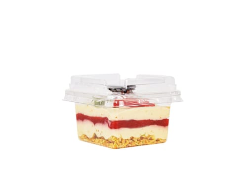 Sweet dessert of cream, jam, muesli and strawberries on a white background. High quality photo