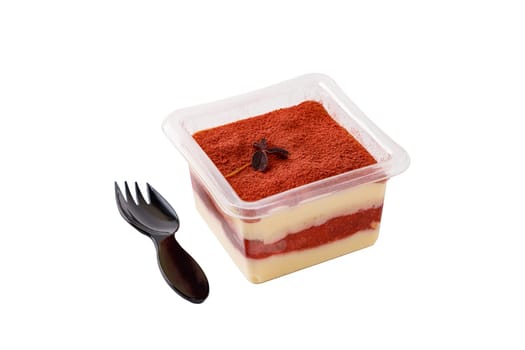 Tiramisu dessert in a plastic box with a fork on a white background. High quality photo