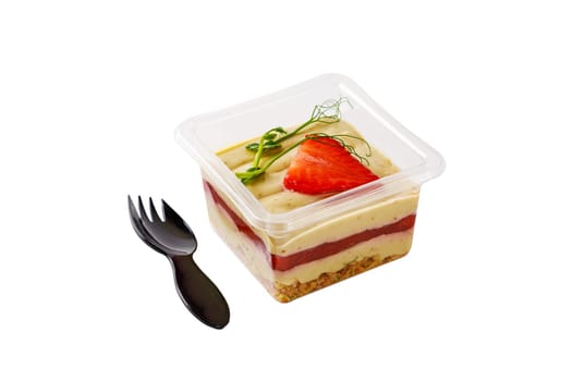 Sweet dessert of cream, jam, muesli and strawberries on a white background. High quality photo