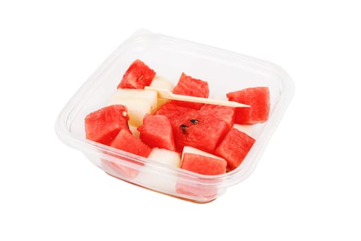 Fruit salad with watermelon and melon in a plastic container on a white background. High quality photo