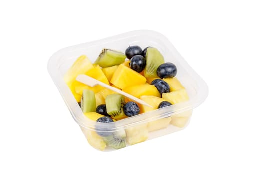 Fruit salad of pineapple, mango, kiwi and blueberries in a plastic container on a white background. High quality photo