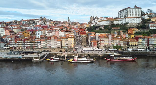 Porto, Portugal - 12.25.2022: Aerial view of the old city of Porto. Portugal old town ribeira aerial promenade view with colorful houses. High quality photo