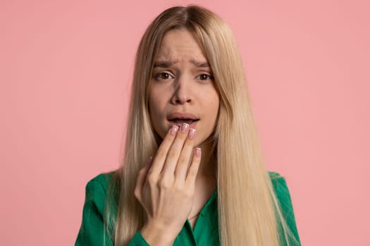 Stressed depressed caucasian woman terrified about danger problems, suffering phobia, anxiety disorder, expresses fear, waving no, insecure, stress panic. Young girl isolated on pink studio background