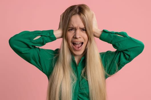 Dont want to hear and listen. Frustrated annoyed irritated caucasian woman covering ears gesturing No, avoiding advice ignoring unpleasant noise loud voices. Pretty girl alone on pink background