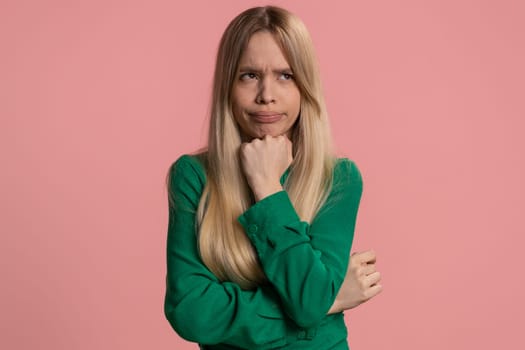 Tired bored caucasian woman indifferent expression, exhausted of tedious story, not interested in communication talk, displeasure, uninteresting. Young teen girl isolated on pink studio background