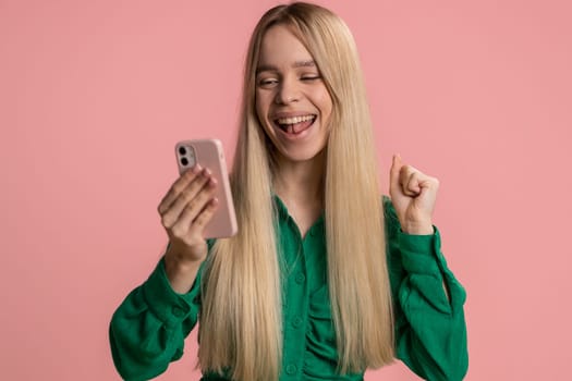 Happy amazed excited joyful caucasian woman girl use smartphone typing browsing shouting say wow yes found out great big win, good news, lottery goal achievemen, celebrating success, winning game