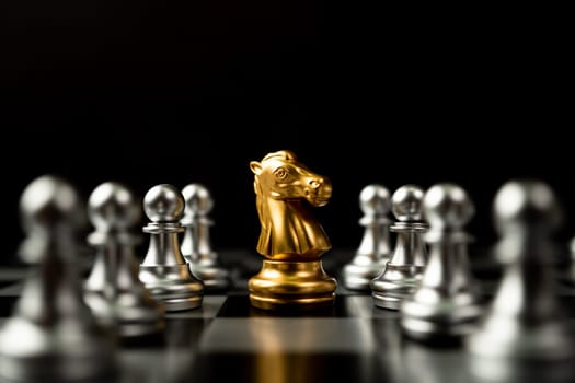 Golden Chess horse standing to Be around of other chess, Concept of a leader must have courage and challenge in the competition, leadership and business vision for a win in business games