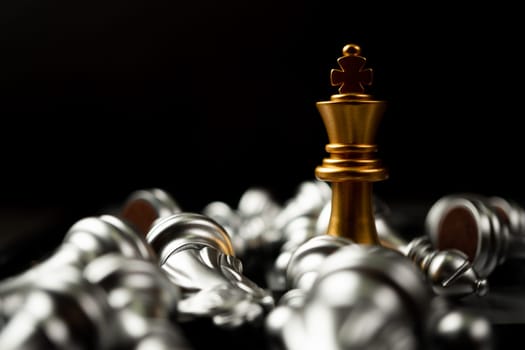 Golden King chess is last standing in the chess board, Concept of successful business leadership