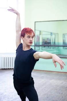 Elegant male dancer practicing new performance in dancing hall