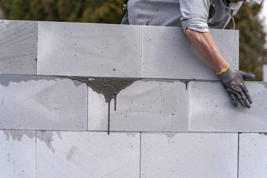 construction of a wall of a house made of aerated concrete blocks.