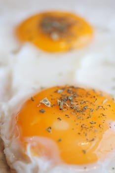 Fried eggs in the plate close up ,,