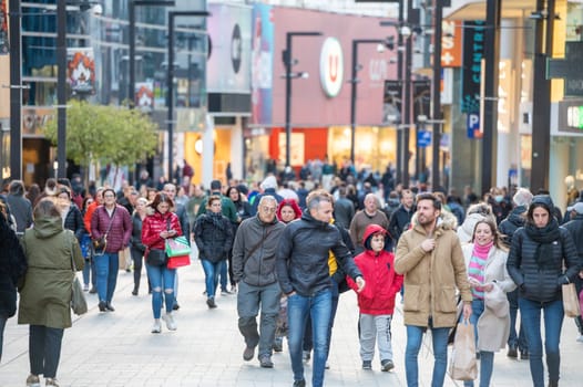 Andorra La Vella, Andorra : 2023 Aprill 15 : People Walk in the Comercial Street named Meritxell. Andorra la Vella, Andorra in winter.