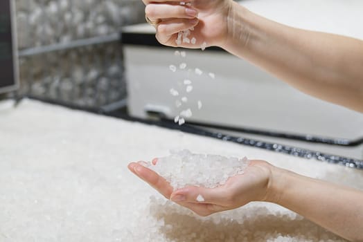 sea salt heap in hands. Rock salt, salt flakes, Nin, Croatia. Nature sea Salt works