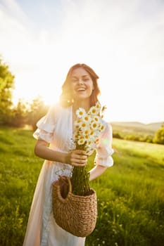 portrait of a woman in a light dress in a meadow with a bouquet of daisies and a wicker basket in her hands. High quality photo