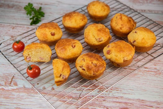 Savory muffin with ham and cheese on blue background, High quality photo