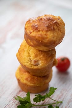 Savory muffin with ham and cheese on blue background, High quality photo