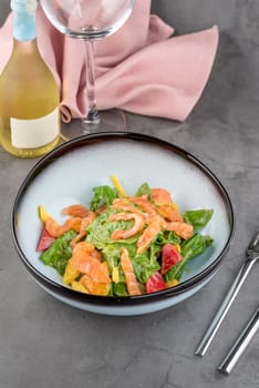 Salmon salad on stone table in fine dining restaurant