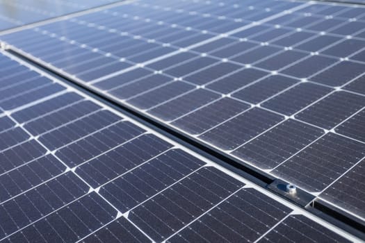 A close-up view of a sheet of several photovoltaic panels stacked one next to the other, ready to be mounted and extracting clean energy from the sun's rays.