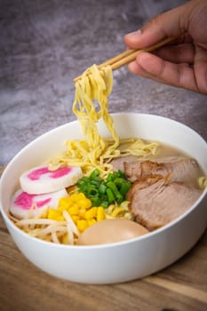 Fresh ramen noodles with garnish, pork tenderloin, eggs marinated in Mirin and soy sauce, bean sprouts, corn, nori leaf, spring onion, and homemade Narutomaki with codfish back, Hight quality