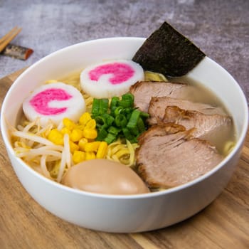 Fresh ramen noodles with garnish, pork tenderloin, eggs marinated in Mirin and soy sauce, bean sprouts, corn, nori leaf, spring onion, and homemade Narutomaki with codfish back, Hight quality