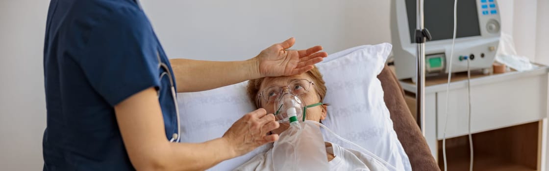 Doctor putting on a breathing mask on a female patient with covid-19. High quality photo