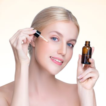 Closeup personable portrait of beautiful woman applying essential oil bottle for skincare product. Cannabis extracted CBD oil dropper for treatment and cannabinoids concept in isolated background.