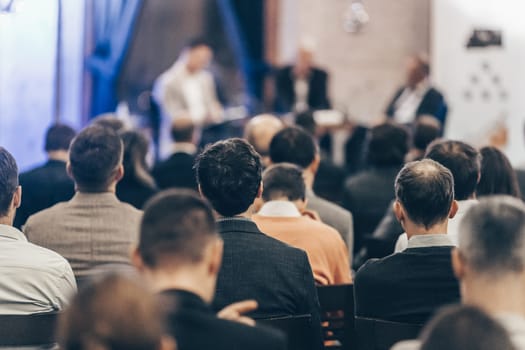 Round table discussion at business convention and Presentation. Audience at the conference hall. Business and entrepreneurship symposium.