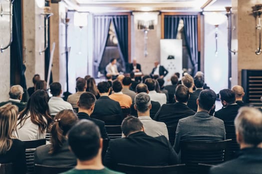 Round table discussion at business convention and Presentation. Audience at the conference hall. Business and entrepreneurship symposium.