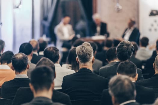 Round table discussion at business convention and Presentation. Audience at the conference hall. Business and entrepreneurship symposium.