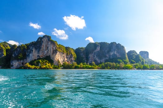 Huge cliff rocks in azure water, Railay beach, Ao Nang, Krabi, Thailand.