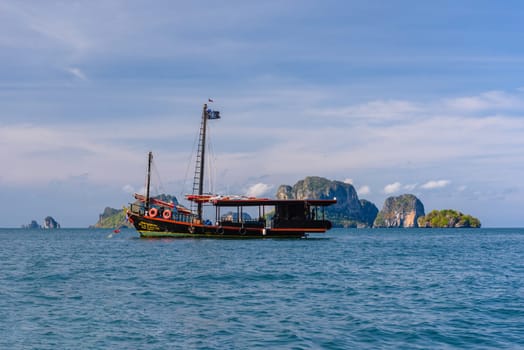 Big pirate ship with Ko Poda and Ko Kai Chicken Island in the background, Tonsai Bay, Railay Beach, Ao Nang, Krabi, Thailand.