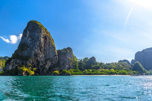 Huge cliff rocks in azure water, Railay beach, Ao Nang, Krabi, Thailand.