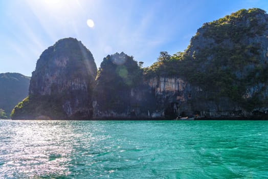 Huge cliff rocks in azure water, Railay beach, Ao Nang, Krabi, Thailand.