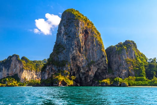 Huge cliff rocks in azure water, Railay beach, Ao Nang, Krabi, Thailand.