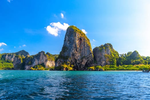 Huge cliff rocks in azure water, Railay beach, Ao Nang, Krabi, Thailand.