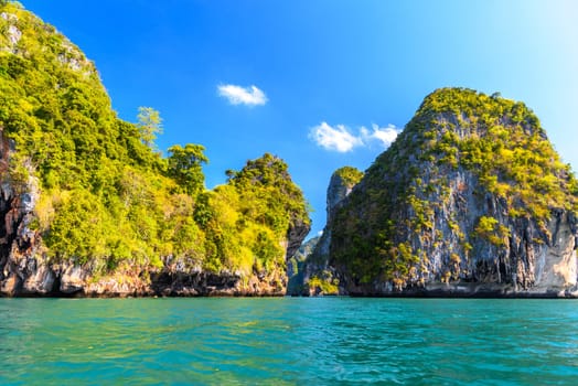 Huge cliff rocks in azure water, Ko Rang Nok, Ao Phra Nang Beach, Ao Nang, Krabi, Thailand.