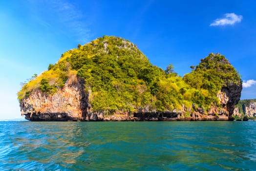 Huge cliff rock in azure water, Ko Rang Nok, Ao Phra Nang Beach, Ao Nang, Krabi, Thailand.